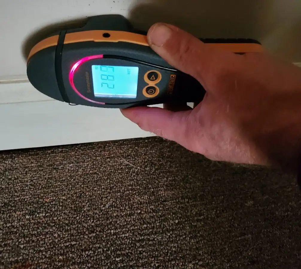 Moisture detection at baseboard during Burst Pipe Cleanup in Rawlins